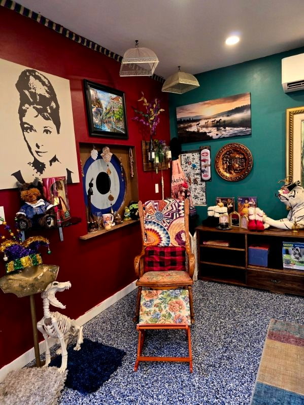 A vintage chair, skeleton, and eclectic curiosities in a shop corner